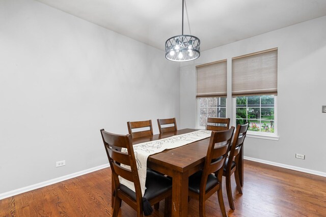 24723 W Champion Dr, Plainfield, IL 60585 - dining area with a chandelier, wood finished floors, and baseboards
