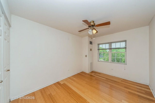 1220 Depot St Unit 411, Glenview, IL 60025 - spare room with light wood-style flooring, ceiling fan, and baseboards