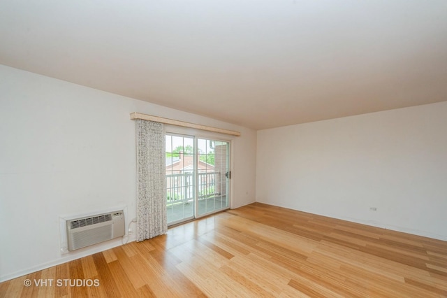 1220 Depot St Unit 411, Glenview, IL 60025 - unfurnished room with light wood-type flooring and a wall mounted AC