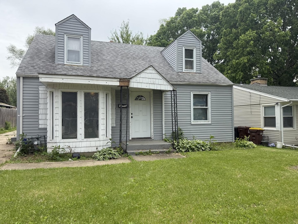 1908 Loomis St, Rockford, IL 61102 - cape cod house with a front yard and roof with shingles