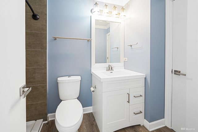 1754 Fieldstone Dr N, Shorewood, IL 60404 - bathroom featuring vanity, a tile shower, toilet, wood finished floors, and baseboards