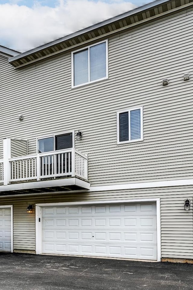 1754 Fieldstone Dr N, Shorewood, IL 60404 - back of house featuring a balcony and an attached garage