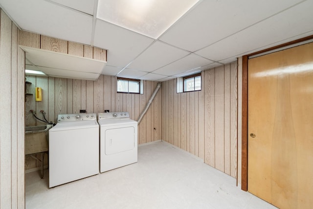 4945 N Neva Ave, Chicago, IL 60656 - laundry area featuring washing machine and dryer, light floors, and wood walls
