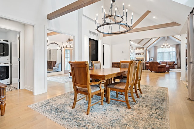 14240 W Forest Dr, Lake Forest, IL 60045 - dining area featuring a chandelier, stacked washer / drying machine, light wood-style floors, recessed lighting, and baseboards