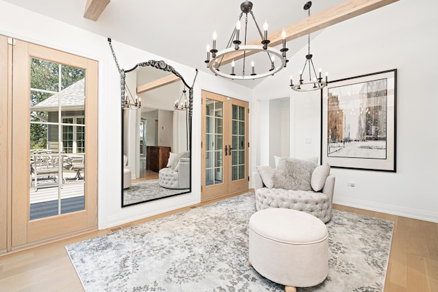 14240 W Forest Dr, Lake Forest, IL 60045 - sitting room with a chandelier, french doors, and light wood-style flooring