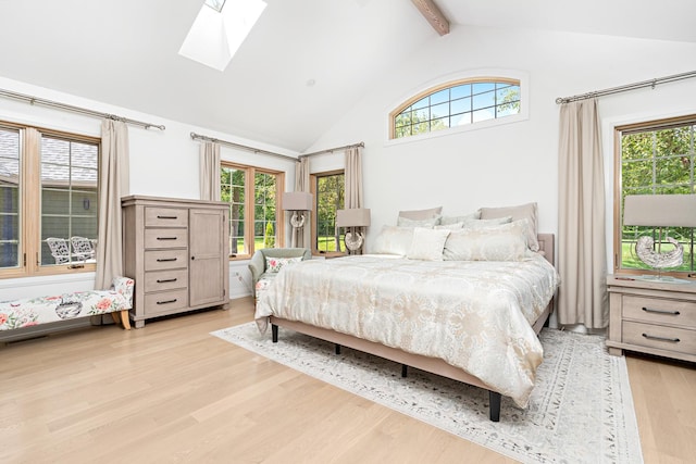 14240 W Forest Dr, Lake Forest, IL 60045 - bedroom with a skylight, light wood-style flooring, beam ceiling, and high vaulted ceiling