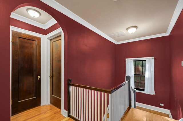 11200 S Longwood Dr, Chicago, IL 60643 - hall featuring wood finished floors, an upstairs landing, arched walkways, crown molding, and baseboards