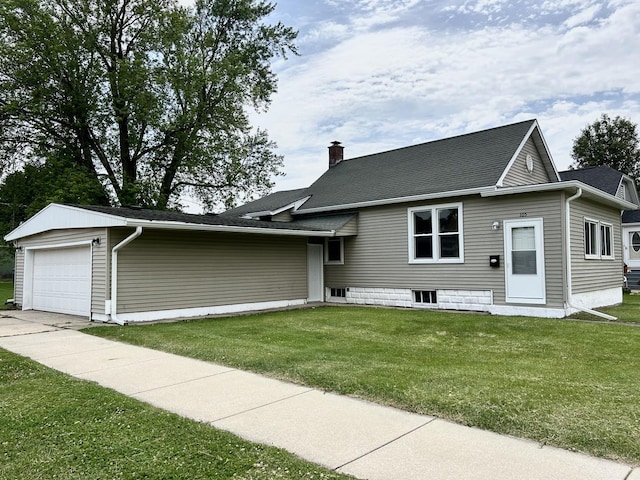 105 W 2nd St, Spring Valley, IL 61362 - view of front of property with a garage, a chimney, a front lawn, and roof with shingles