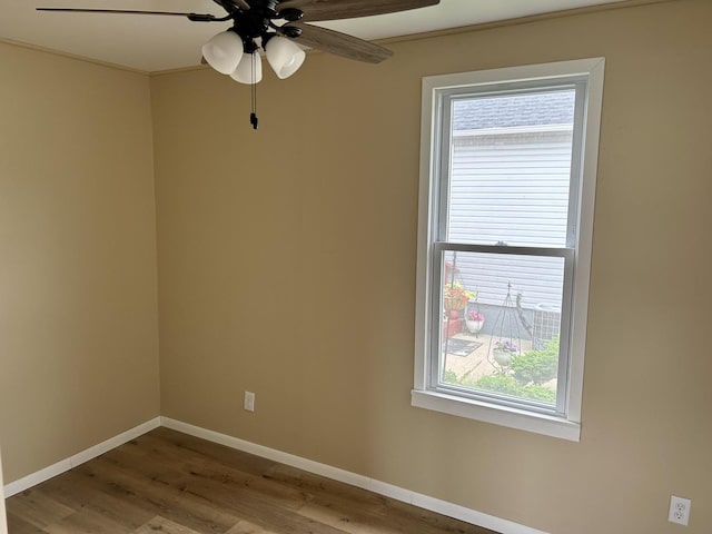 105 W 2nd St, Spring Valley, IL 61362 - empty room featuring a ceiling fan, wood finished floors, and baseboards