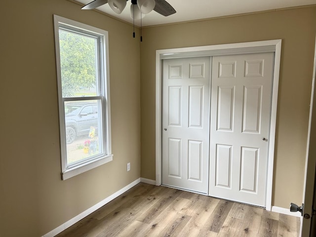 105 W 2nd St, Spring Valley, IL 61362 - unfurnished bedroom featuring baseboards, light wood finished floors, and a closet