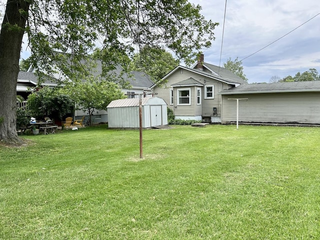 105 W 2nd St, Spring Valley, IL 61362 - rear view of property featuring a lawn and a chimney