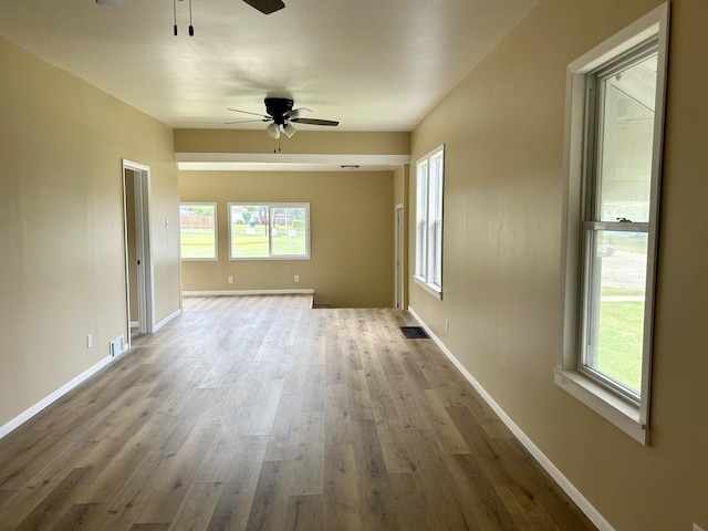 105 W 2nd St, Spring Valley, IL 61362 - empty room with ceiling fan, wood finished floors, and baseboards