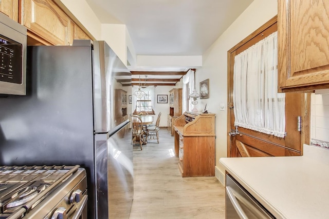 266 S Warrington Rd, Des Plaines, IL 60016 - kitchen with stainless steel appliances, light wood-type flooring, and light countertops