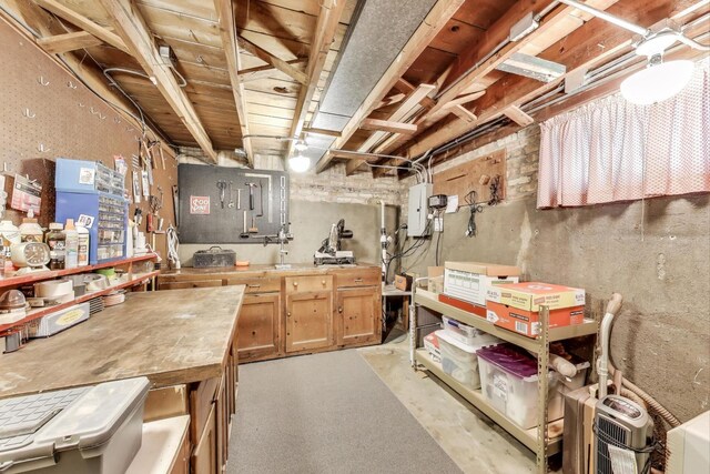 266 S Warrington Rd, Des Plaines, IL 60016 - unfinished basement featuring a workshop area and electric panel