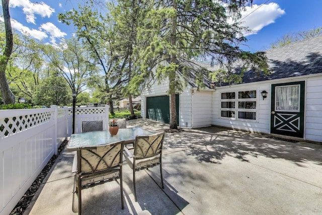 266 S Warrington Rd, Des Plaines, IL 60016 - view of patio with outdoor dining space and a garage