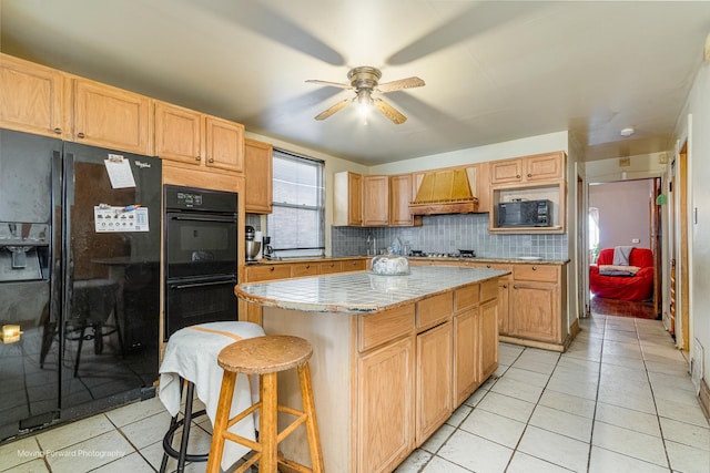 1508 N Massasoit Ave, Chicago, IL 60651 - kitchen featuring black appliances, premium range hood, ceiling fan, and light tile patterned floors