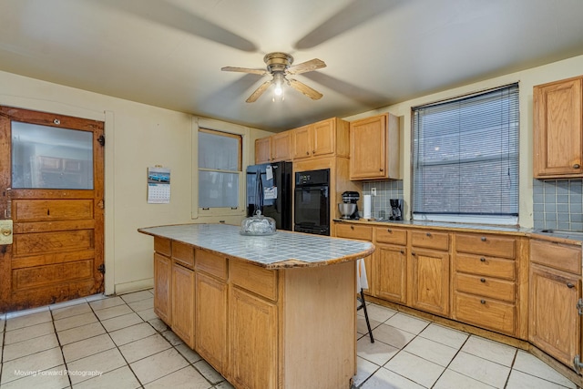 1508 N Massasoit Ave, Chicago, IL 60651 - kitchen with black appliances, light tile patterned floors, tasteful backsplash, and ceiling fan