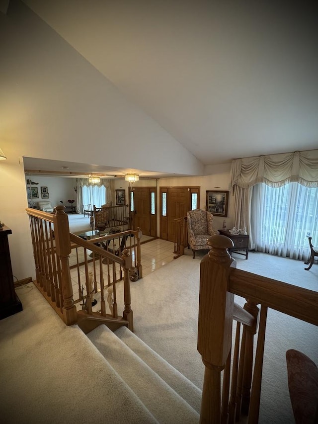 3006 Hawthorne Ln, Hazel Crest, IL 60429 - staircase featuring carpet flooring, high vaulted ceiling, and healthy amount of natural light