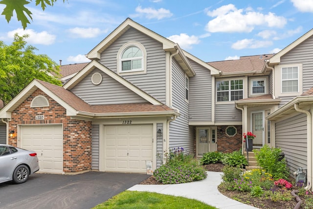1322 Coldspring Rd, Carol Stream, IL 60188 - view of property featuring brick siding, asphalt driveway, and a shingled roof