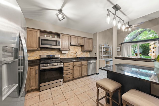 1322 Coldspring Rd, Carol Stream, IL 60188 - kitchen featuring stainless steel appliances, a sink, tasteful backsplash, ceiling fan, and light tile patterned floors