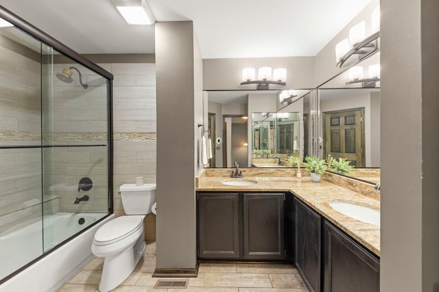 1322 Coldspring Rd, Carol Stream, IL 60188 - full bathroom with double vanity, shower / bath combination with glass door, and toilet