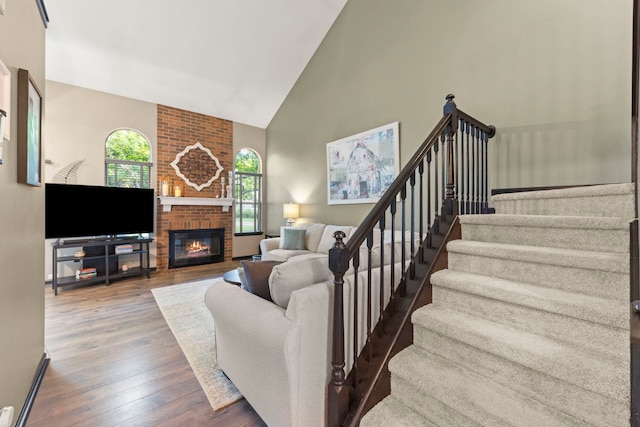 1322 Coldspring Rd, Carol Stream, IL 60188 - living area with stairs, hardwood / wood-style floors, high vaulted ceiling, a fireplace, and baseboards