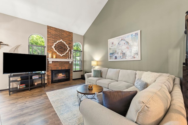 1322 Coldspring Rd, Carol Stream, IL 60188 - living area featuring high vaulted ceiling, a brick fireplace, wood finished floors, and baseboards
