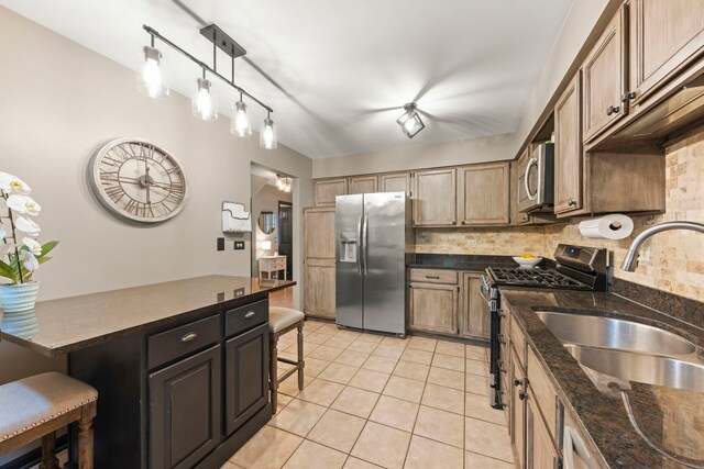 1322 Coldspring Rd, Carol Stream, IL 60188 - kitchen featuring stainless steel appliances, a sink, decorative backsplash, and a kitchen breakfast bar