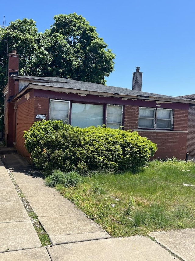 11115 S S Ave L, Chicago, IL 60617 - view of property exterior featuring a chimney and brick siding