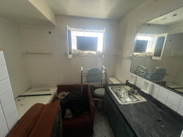 11115 S S Ave L, Chicago, IL 60617 - full bath featuring tile walls, plenty of natural light, vanity, tile patterned floors, and toilet