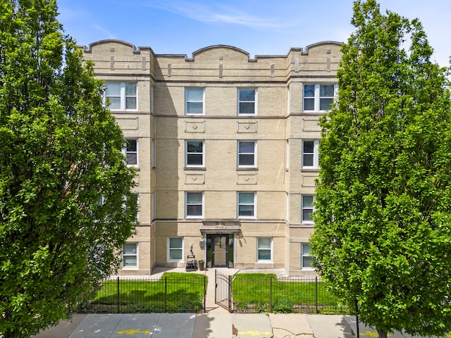 5054 N Troy St Unit 3, Chicago, IL 60625 - view of apartment building / complex with a fenced front yard