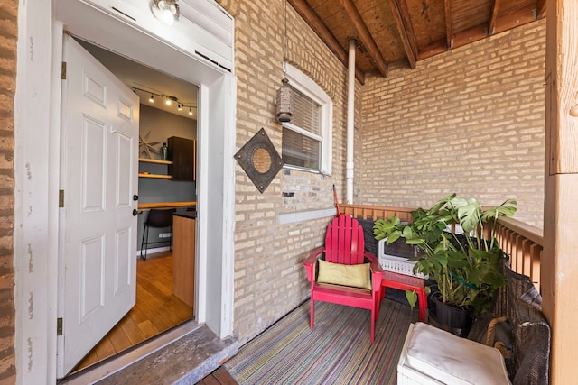 5054 N Troy St Unit 3, Chicago, IL 60625 - doorway to property with brick siding and covered porch