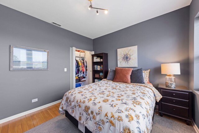 5054 N Troy St Unit 3, Chicago, IL 60625 - bedroom featuring wood finished floors, baseboards, a spacious closet, and a closet
