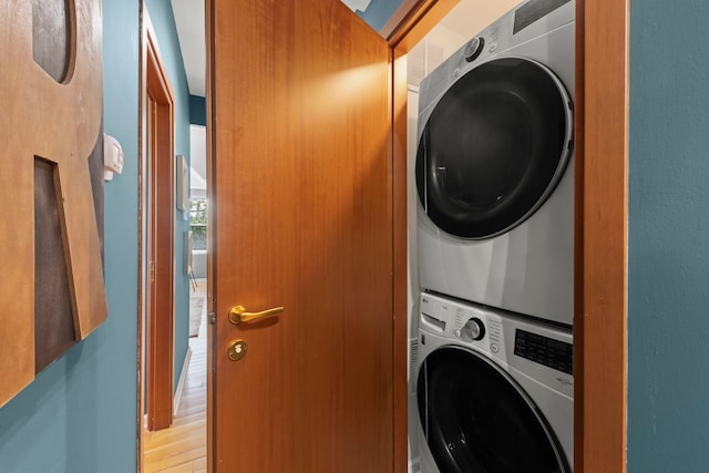 5054 N Troy St Unit 3, Chicago, IL 60625 - laundry room with stacked washing machine and dryer and light wood-style flooring