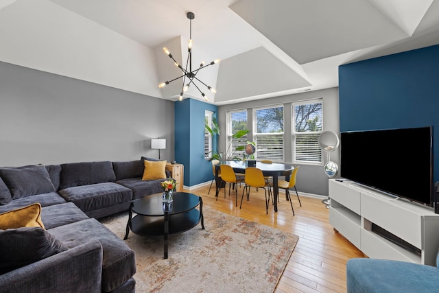 5054 N Troy St Unit 3, Chicago, IL 60625 - living room featuring a chandelier, hardwood / wood-style flooring, and baseboards