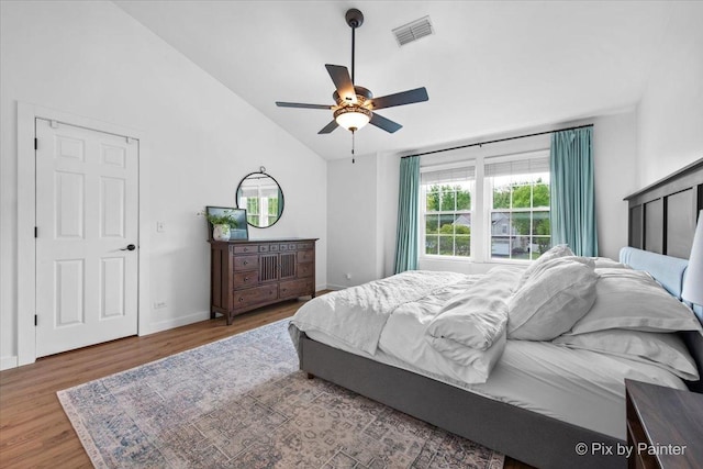 2552 Autumn Grove Ct, Aurora, IL 60504 - bedroom featuring wood finished floors, lofted ceiling, baseboards, and a ceiling fan