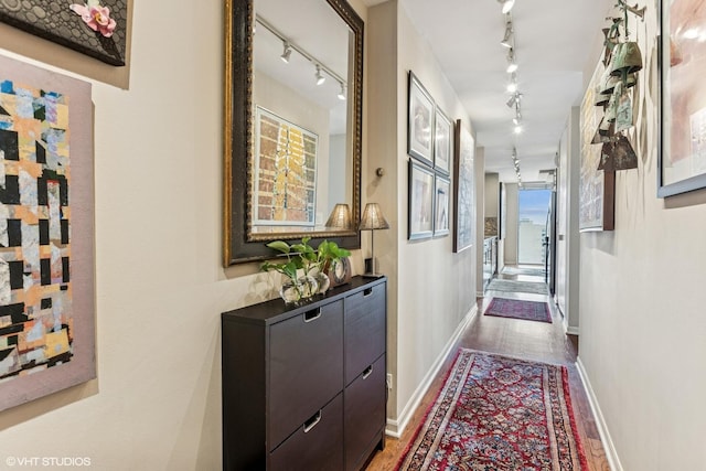 71 E Division St Unit 1606, Chicago, IL 60610 - corridor with track lighting, wood finished floors, and baseboards