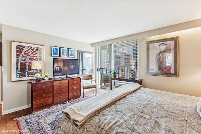 71 E Division St Unit 1606, Chicago, IL 60610 - bedroom with access to outside, wood finished floors, and baseboards