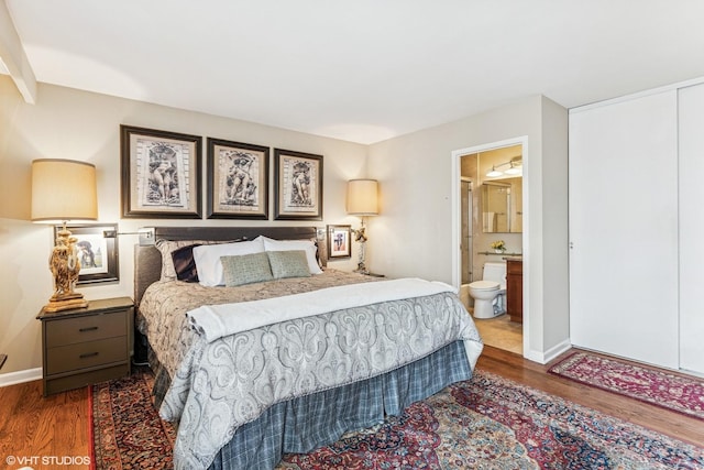 71 E Division St Unit 1606, Chicago, IL 60610 - bedroom featuring wood finished floors, baseboards, and ensuite bath