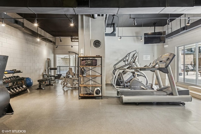 71 E Division St Unit 1606, Chicago, IL 60610 - workout area with a high ceiling and concrete block wall