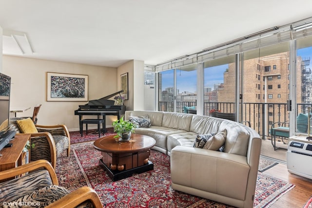 71 E Division St Unit 1606, Chicago, IL 60610 - living room featuring a view of skyline and wood finished floors