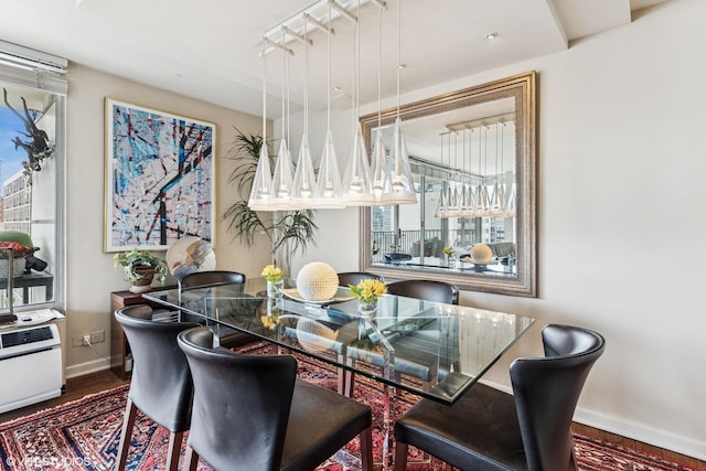 71 E Division St Unit 1606, Chicago, IL 60610 - dining space featuring baseboards, wood finished floors, and plenty of natural light