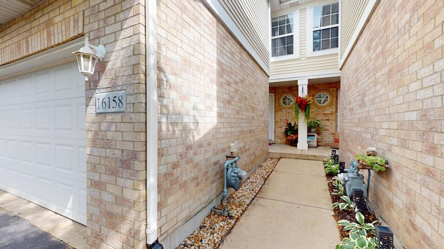 16158 Hillcrest Cir, Orland Park, IL 60467 - doorway to property with a garage and brick siding