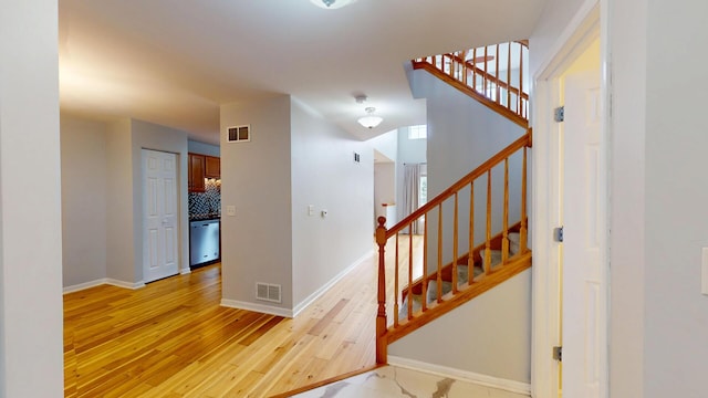 16158 Hillcrest Cir, Orland Park, IL 60467 - staircase with hardwood / wood-style flooring and baseboards