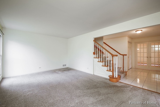 2755 Newport Dr, Naperville, IL 60565 - carpeted spare room featuring french doors and stairs
