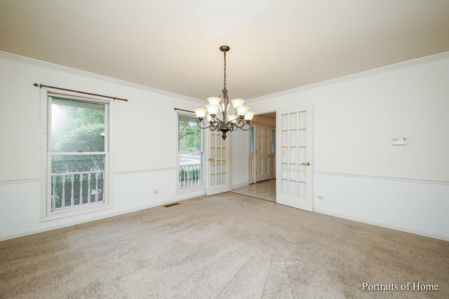 2755 Newport Dr, Naperville, IL 60565 - carpeted empty room featuring a chandelier, crown molding, and french doors