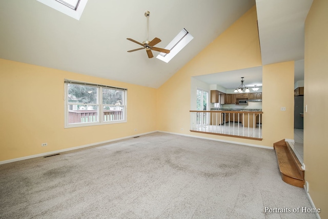 2755 Newport Dr, Naperville, IL 60565 - unfurnished living room featuring a skylight, high vaulted ceiling, a chandelier, and plenty of natural light