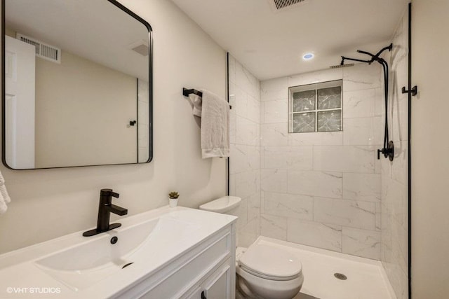 1134 N Dunton Ave, Arlington Heights, IL 60004 - full bathroom featuring vanity, toilet, tiled shower, and recessed lighting