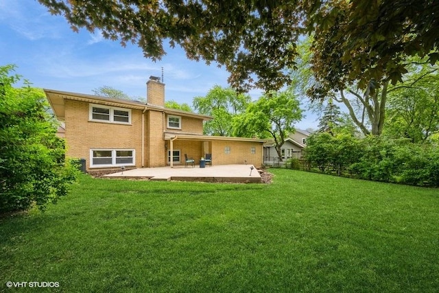 1134 N Dunton Ave, Arlington Heights, IL 60004 - back of house featuring a chimney, a patio, and brick siding
