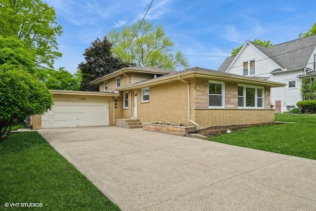 1134 N Dunton Ave, Arlington Heights, IL 60004 - view of front of home with an attached garage, concrete driveway, a front yard, and brick siding